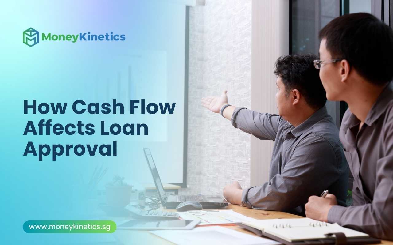 Business partners reviewing cash flow projections before applying for a business loan in Singapore