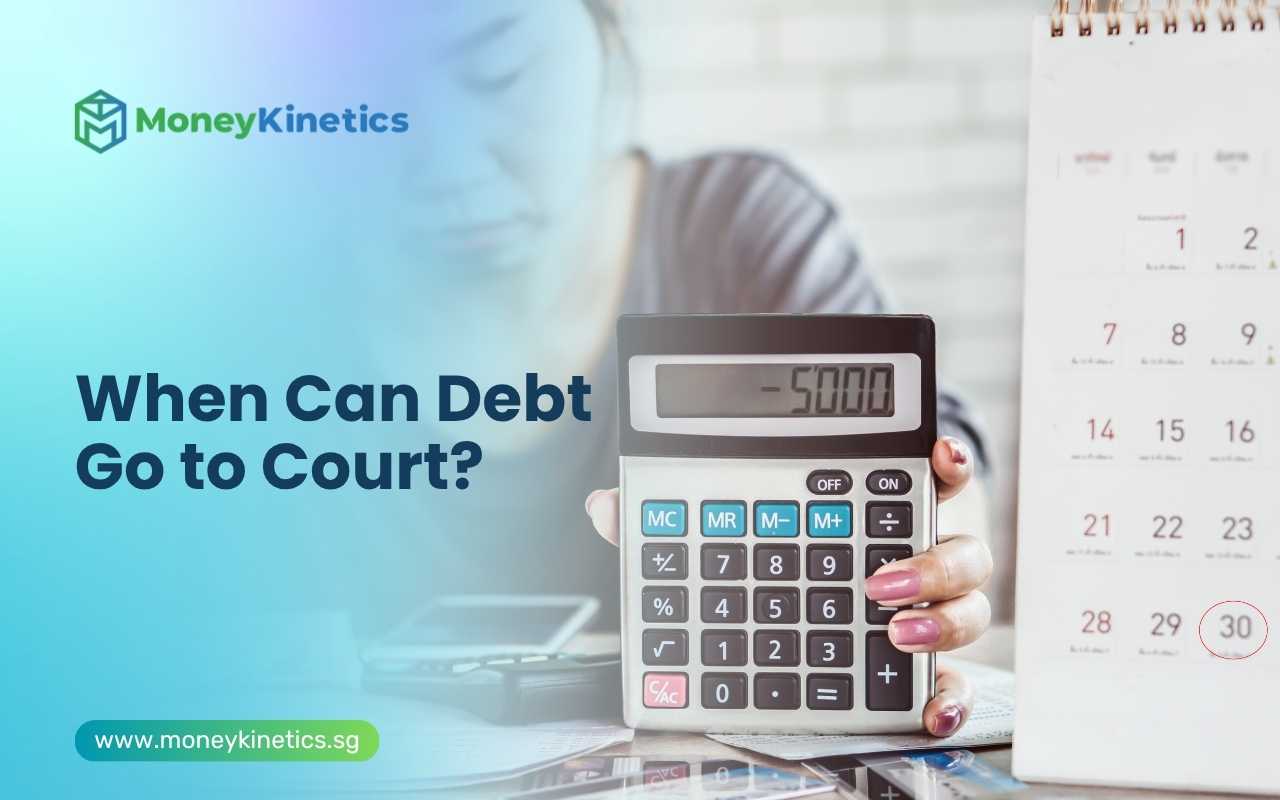 Calculator displaying outstanding debt amount beside a calendar and financial documents