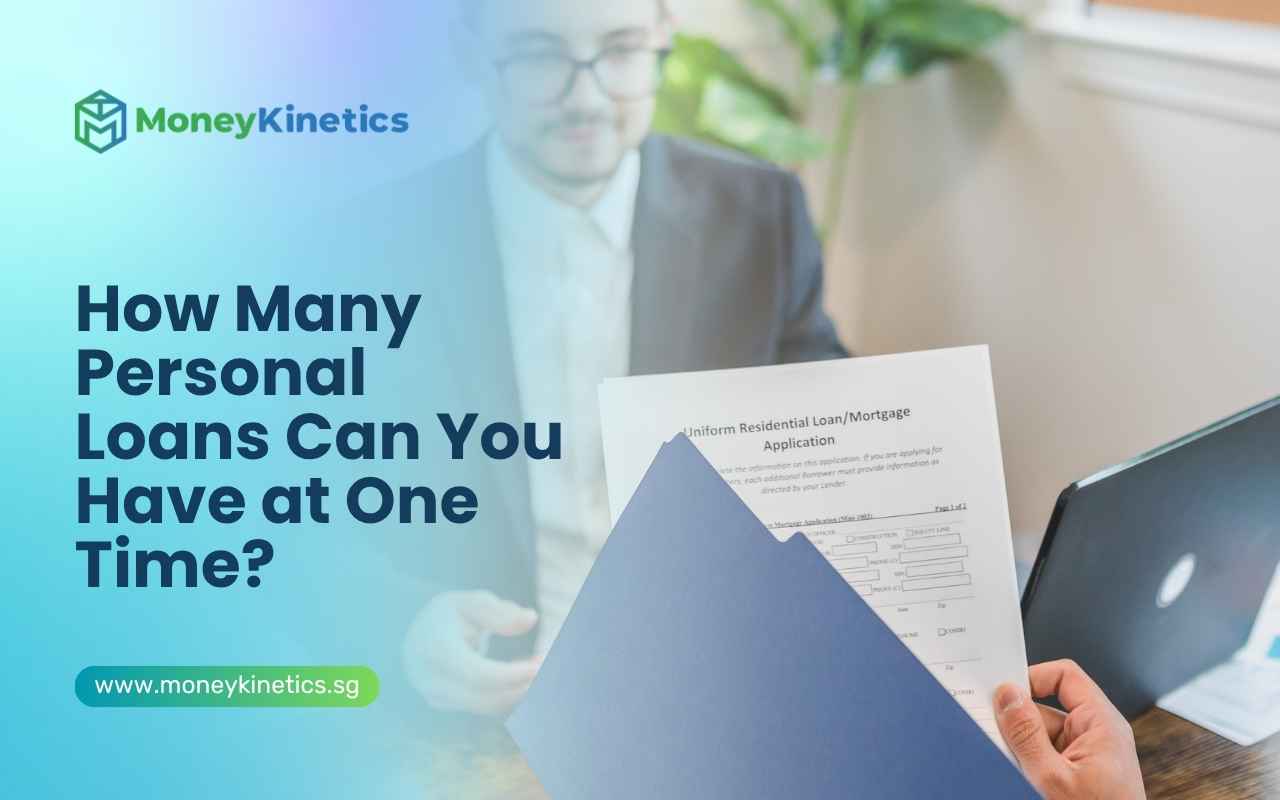 Borrower reviewing loan documents while discussing multiple personal loans with a financial representative.