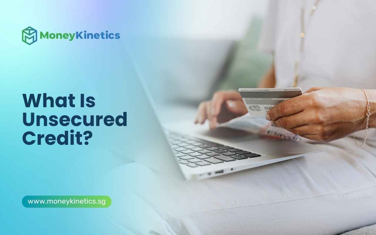 Person using a credit card and laptop representing unsecured credit in Singapore.